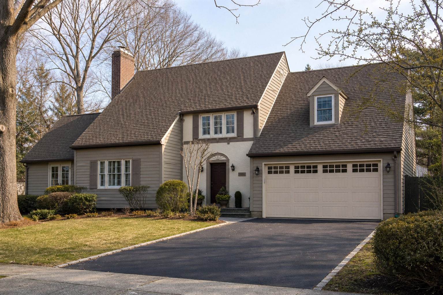 Suburban Haddonfield home with a visible attached garage door in natural daylight